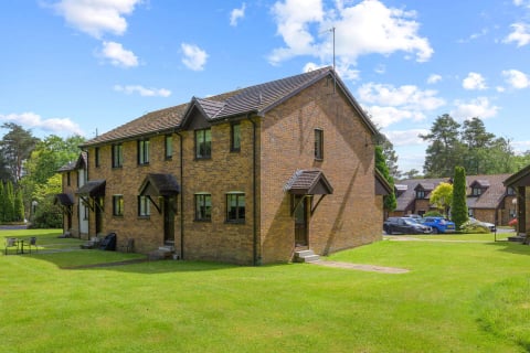The brick mews house on the green at Gleneagles Village