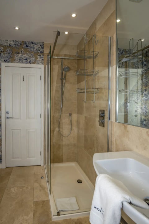 Walk-in shower with stone tiling
