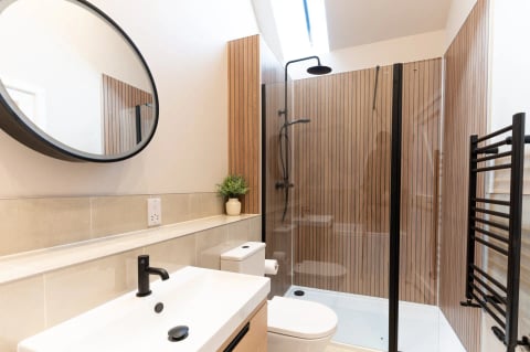 Shower with timber slat wall and skylight