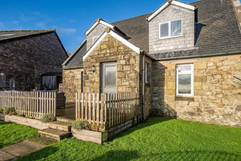 Cottage entrance with decked steps
