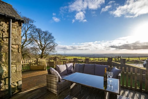 Corner sofa on the deck with countryside views
