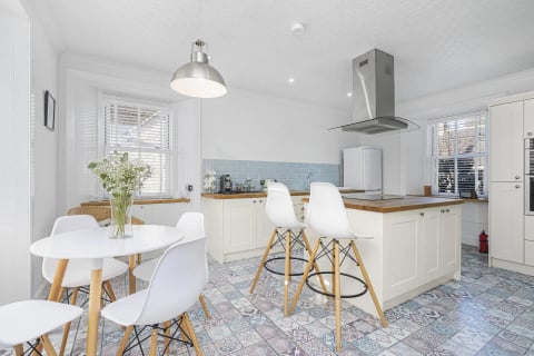 Kitchen and dining space with flowers on the table