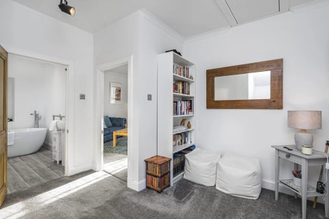 Snug corner with bookcase and bean bags