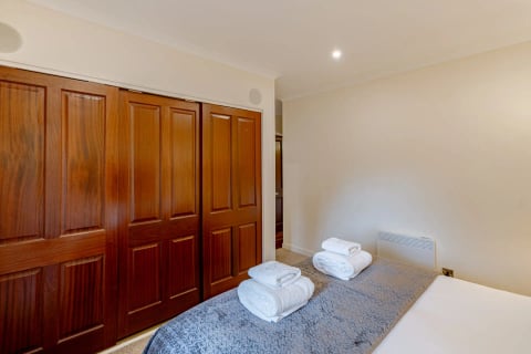 Mahogany fitted wardrobes in the bedroom