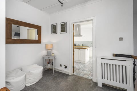 Hall mirror looking into the kitchen
