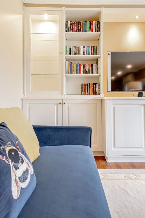 Lounge bookcase and navy sofa detail