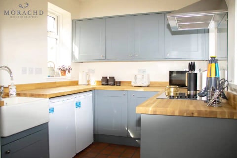 Duck-egg kitchen with butcher-block worktops
