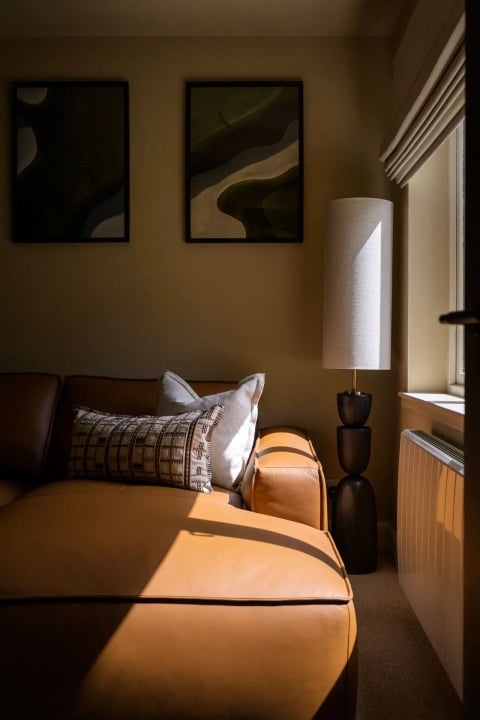 Reading lamp beside the leather sofa