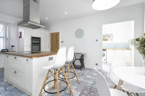 Island seating beside the vintage sewing table