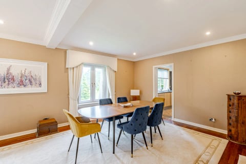 Dining room with mustard and navy chairs
