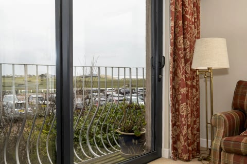 The balcony rail overlooking the 18th fairway