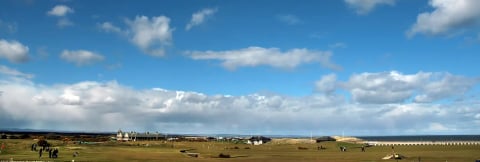 Big skies over the links and distant town