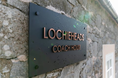 The Coach House bronze name plaque