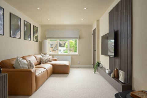 Snug with leather sofa and roman blinds