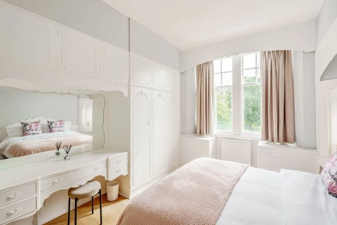 Vintage dressing table with mirror in the bedroom