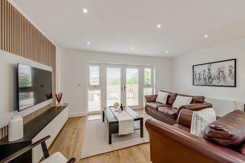 Living room with French doors onto the deck