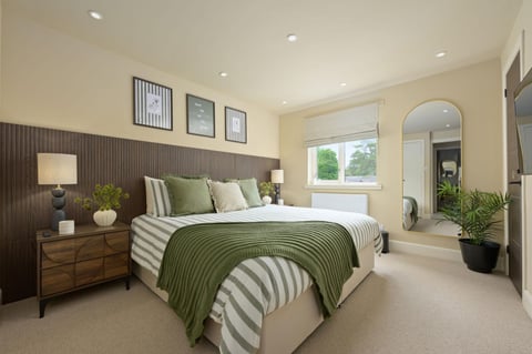 Immaculately presented bedroom, styled in sage green and cream