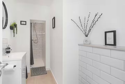 Walk-in shower with white metro tiles