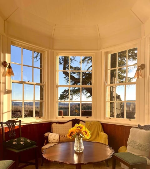 Window seat in the bay with sunflowers on the table