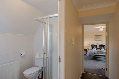 Shower room with WC looking into the bedroom