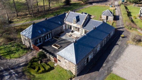 The slate-roofed Coach House and courtyard from above