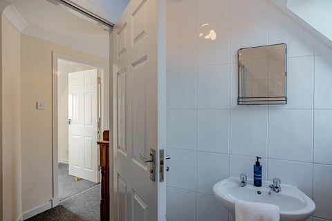 Bathroom door open to the landing
