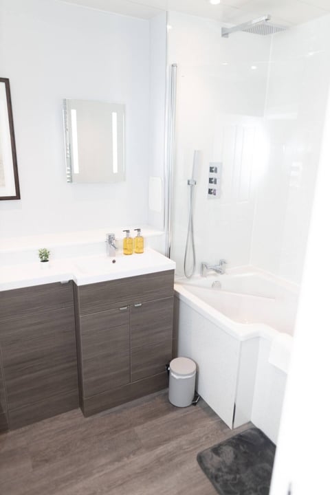 Bathroom with twin basins and bath