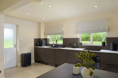 Kitchen with twin windows onto the green