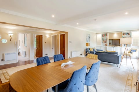 Dining table for six with blue upholstered chairs