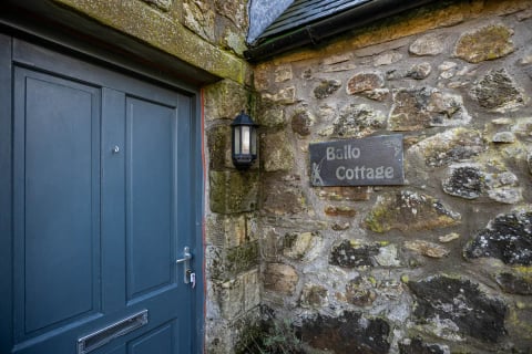 Ballo Cottage slate name plaque by the blue door