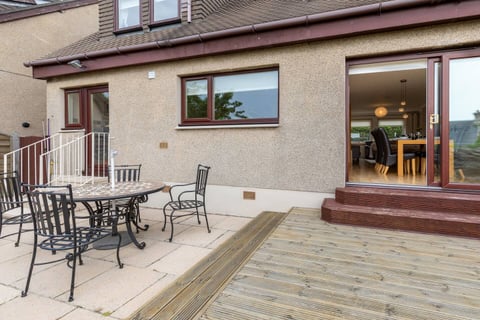 Rear patio with outdoor dining table