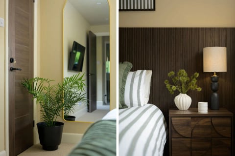 Full-length mirror with palm and bed reflection