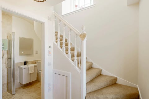 White staircase and landing