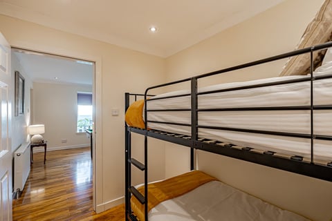 Bunk beds on the polished wooden floor