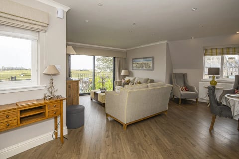 Sitting area with sofas and doors to the balcony