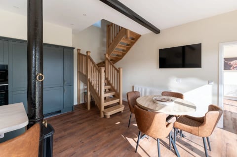 Oak staircase beside the dining table