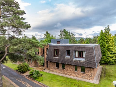 The apartment building among mature pines at Gleneagles