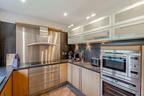 Kitchen with double oven, coffee machine and toaster