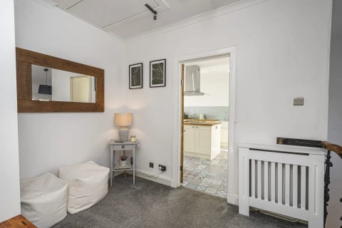 Lamp table by the kitchen door