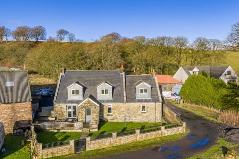 The cottage and neighbouring steading from above