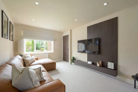 Lounge with media wall and window onto the garden
