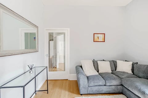 Sitting room with glazed double doors to the hall