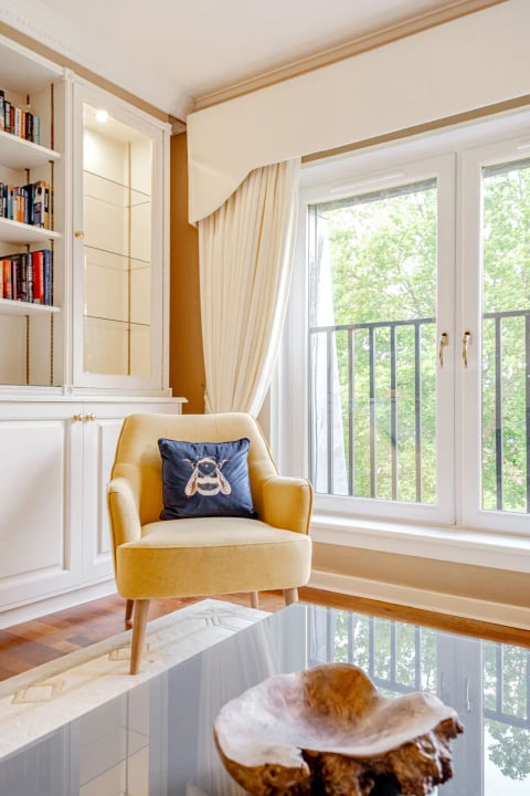Sitting corner with bee cushion and garden outlook