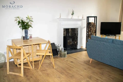 Dining table beside the wood-burning stove