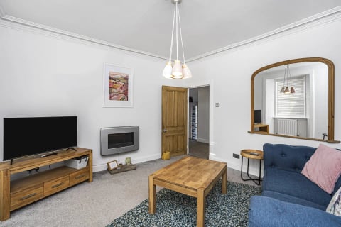 Sitting room with wall fire and oak table