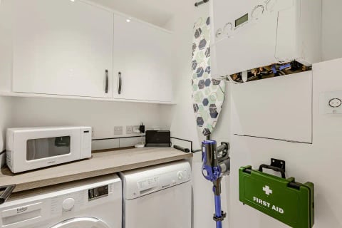 Utility with washing machine, vacuum and first aid kit