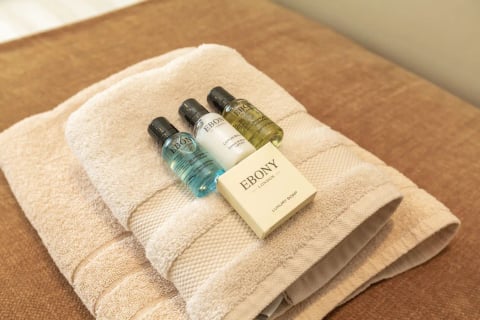 Guest toiletries on folded towels