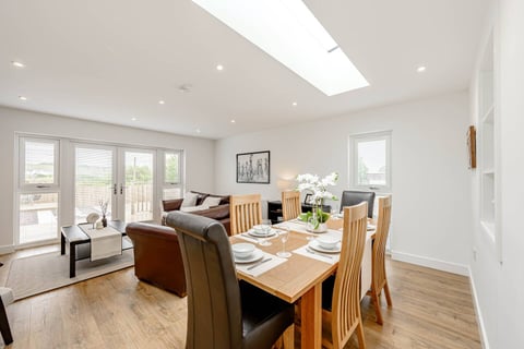 Dining area beside the lounge with French doors