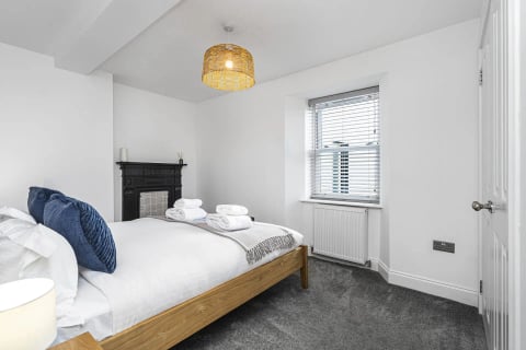 Double bedroom with black Victorian fireplace