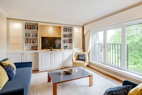 TV and bookcase wall with sofa seating